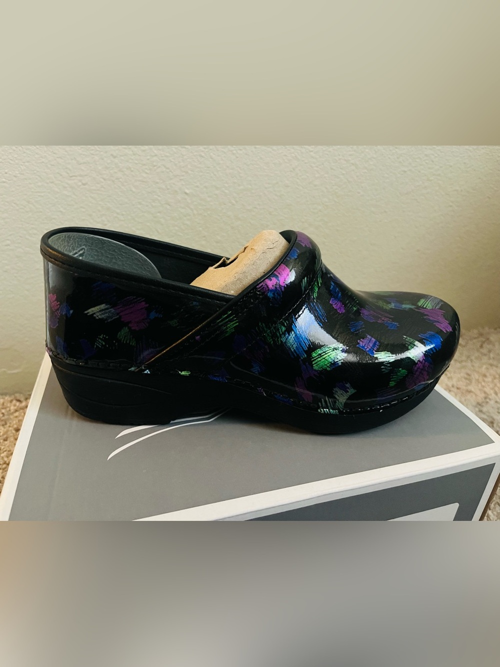 New, Women Dansko multicolor clogs.
